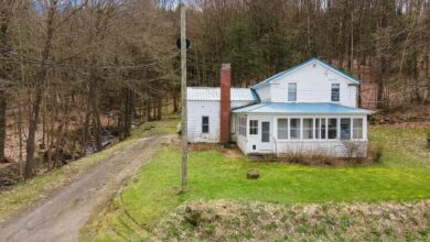 Photo of Country farmhouse on 10 acres. Woods & stream. $129,900